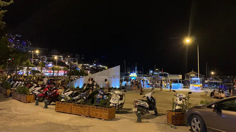 parking lots in kas town of antalya with motocycles paked at night